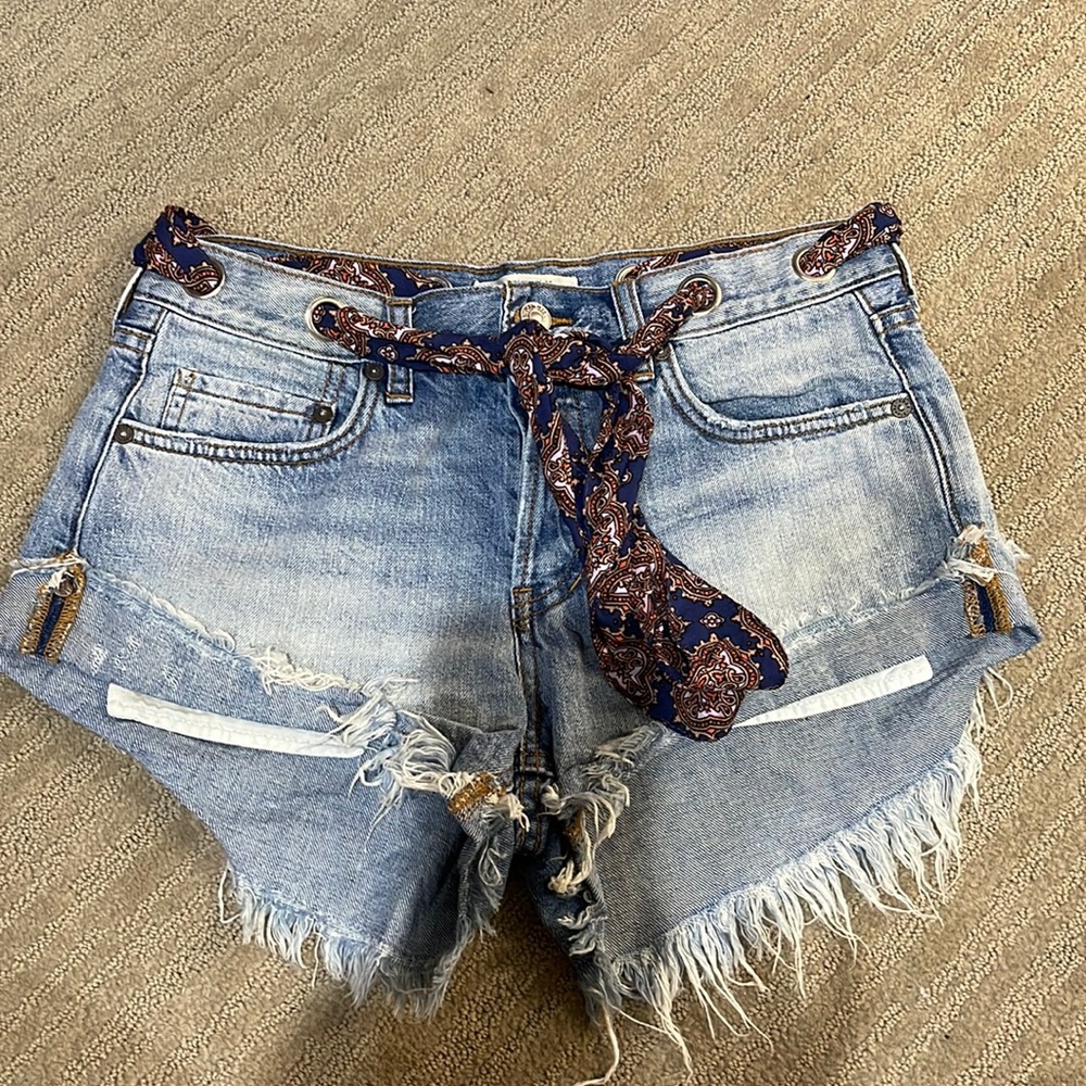 Denim shorts with distressing